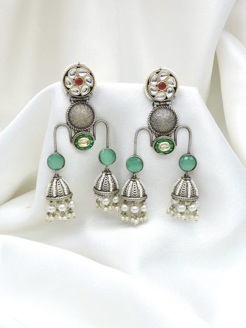 Oxidized silver green kundan jhumka drop earrings with pearl detailing by joyrias