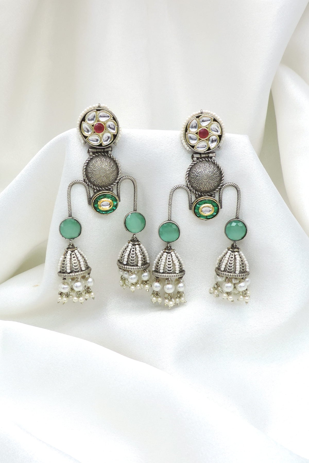 Oxidized silver green kundan jhumka drop earrings with pearl detailing by joyrias
