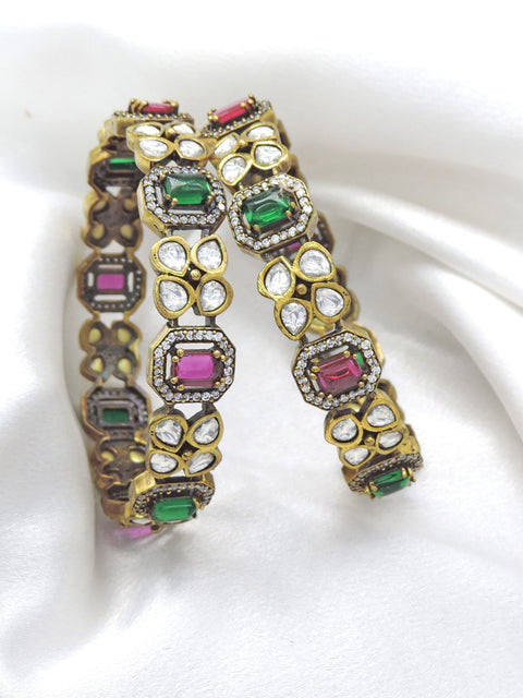 Opulent emerald ruby CZ AD bangle set with intricate stone accents by joyrias