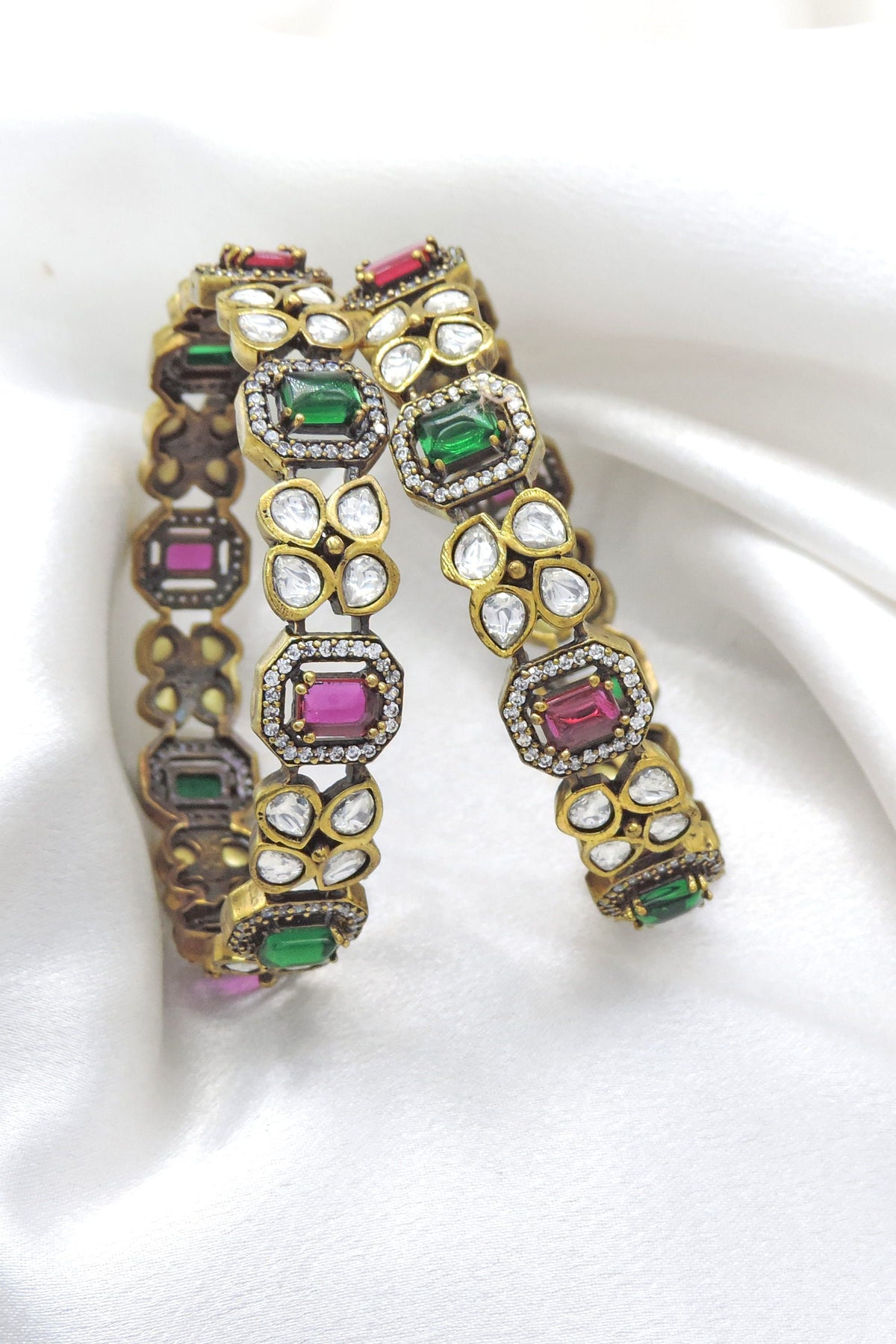 Opulent emerald ruby CZ AD bangle set with intricate stone accents by joyrias