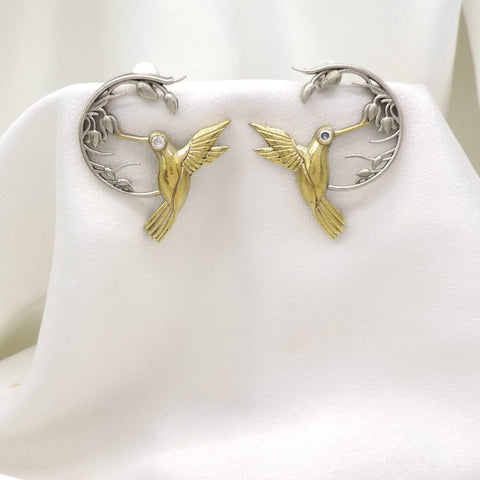 Oxidized dual-tone bird motif ear cuff earrings with gold-toned detailing by joyrias
