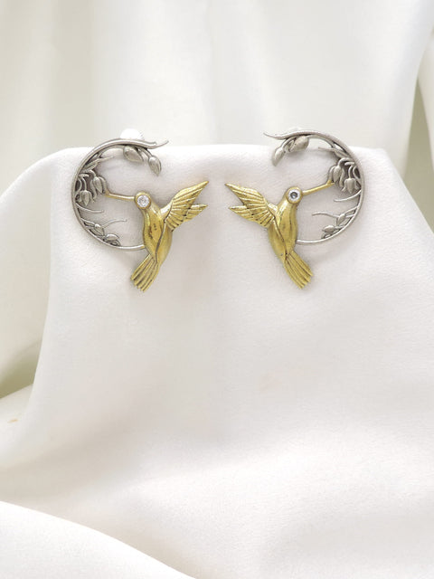 Oxidized dual-tone bird motif ear cuff earrings with gold-toned detailing by joyrias