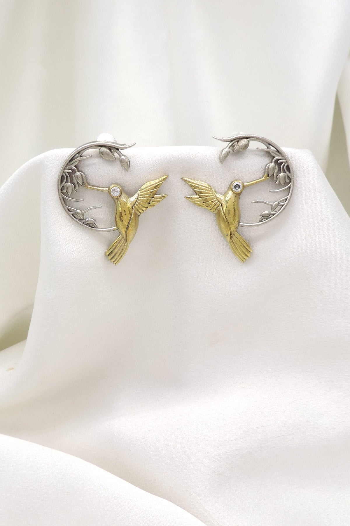 Oxidized dual-tone bird motif ear cuff earrings with gold-toned detailing by joyrias