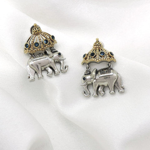 Oxidized dual-tone elephant jhumka earrings with blue stone and gold-toned detailing by joyrias