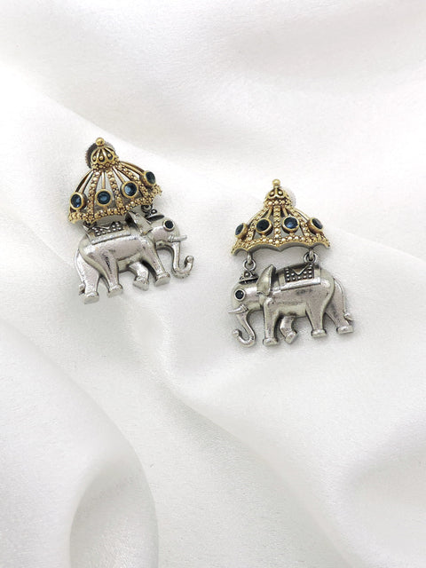 Oxidized dual-tone elephant jhumka earrings with blue stone and gold-toned detailing by joyrias