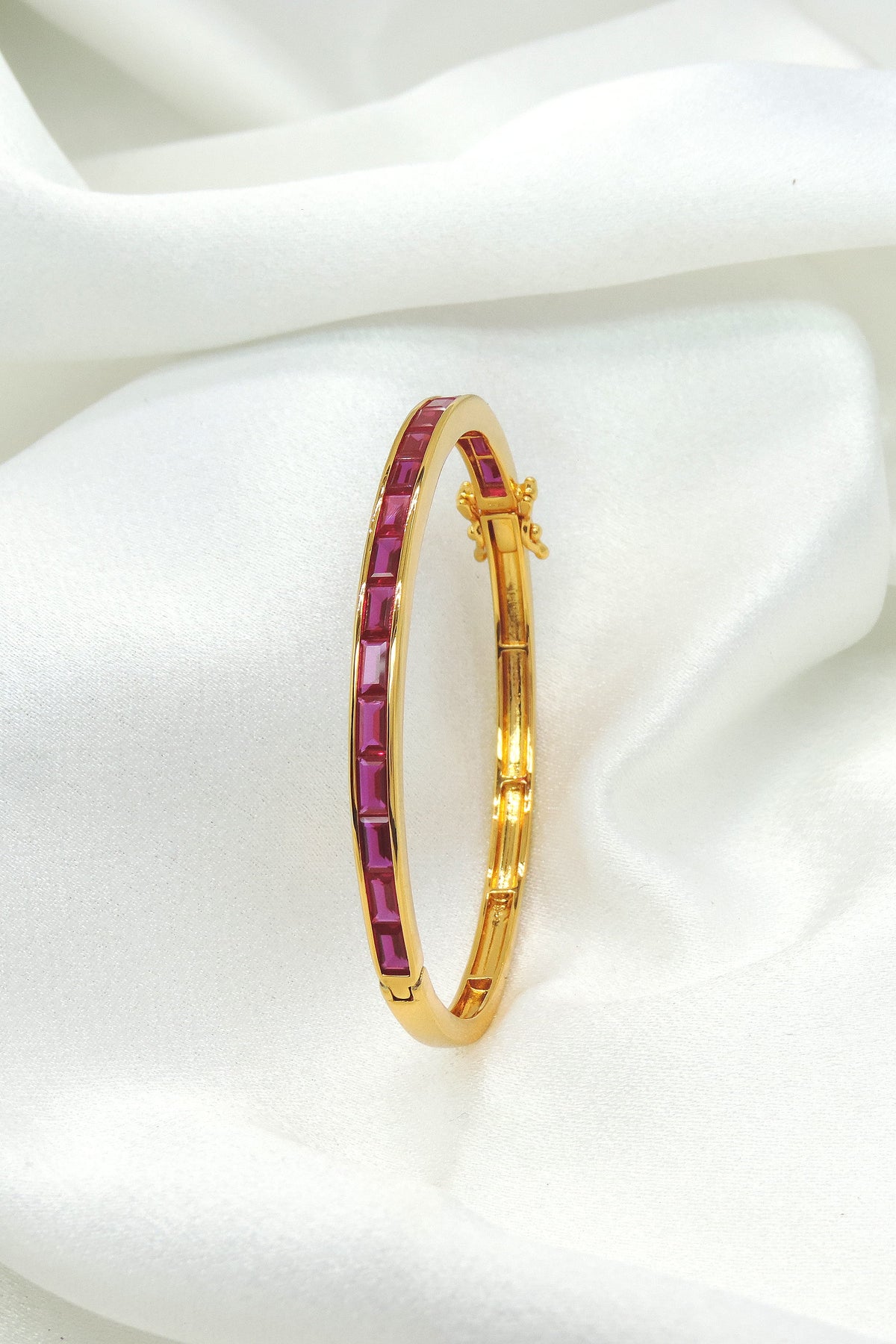 Ruby red baguette gold tone kada bracelet by Joyrias