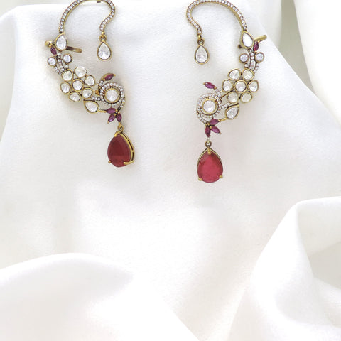 Gold-toned ruby kundan floral ear cuff earrings with teardrop stone detailing by joyrias