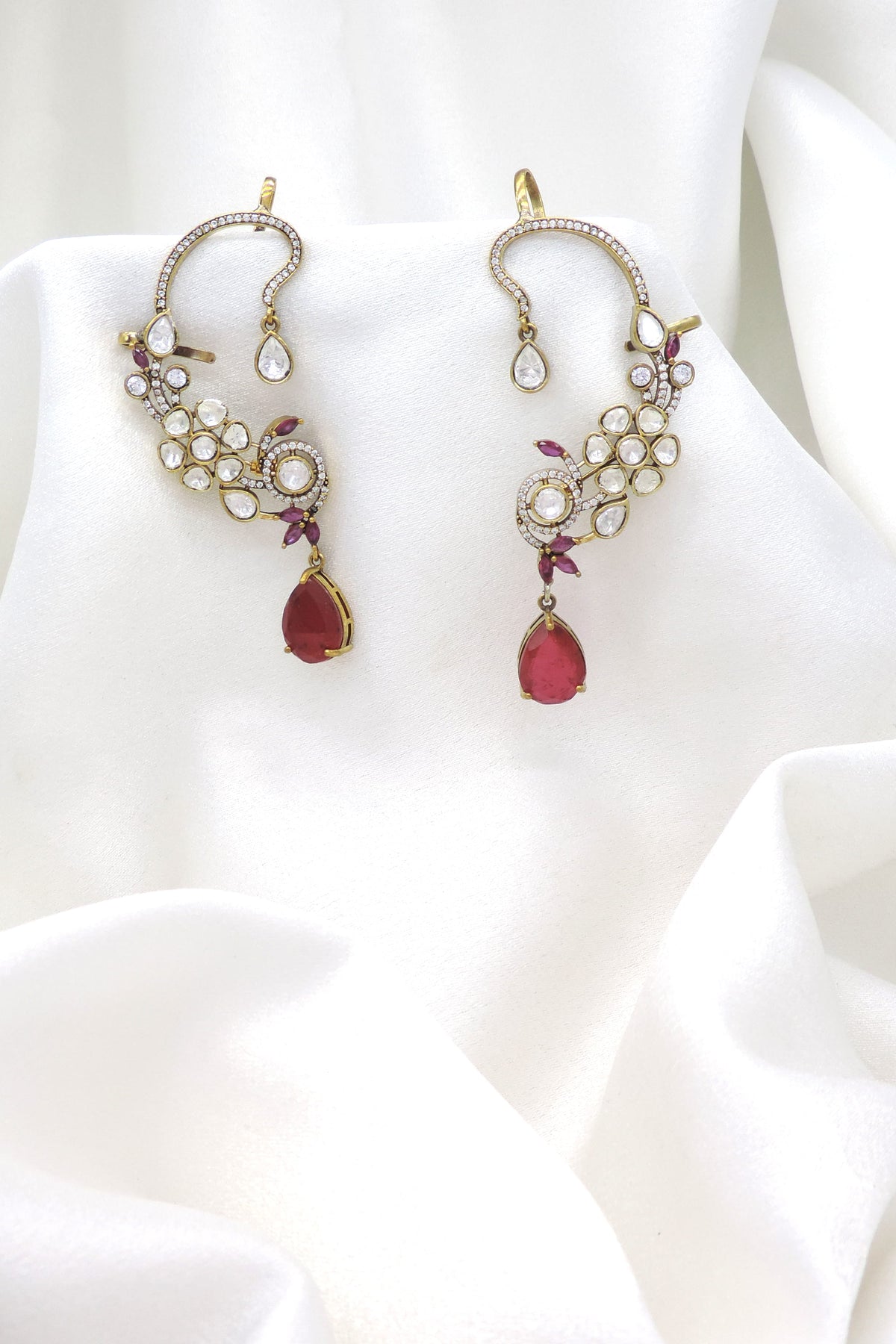 Gold-toned ruby kundan floral ear cuff earrings with teardrop stone detailing by joyrias