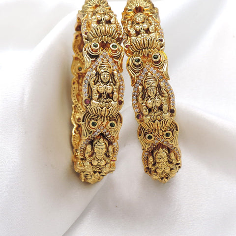 Temple Lakshmi kundan bangle set with ornate gold tone detailing by joyrias