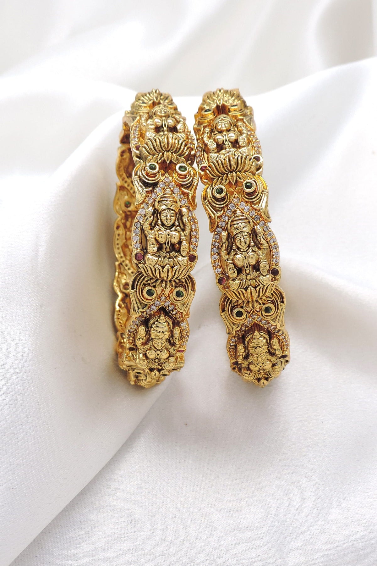 Temple Lakshmi kundan bangle set with ornate gold tone detailing by joyrias