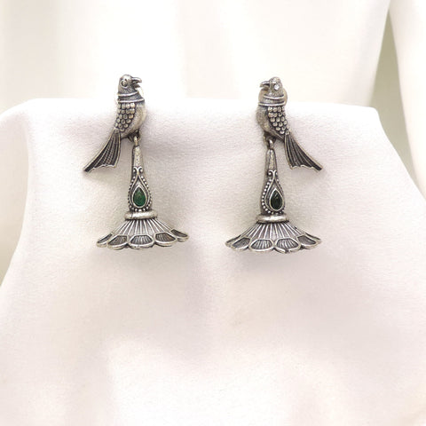 Oxidized silver peacock green stone drop earrings with detailed feather motif by joyrias