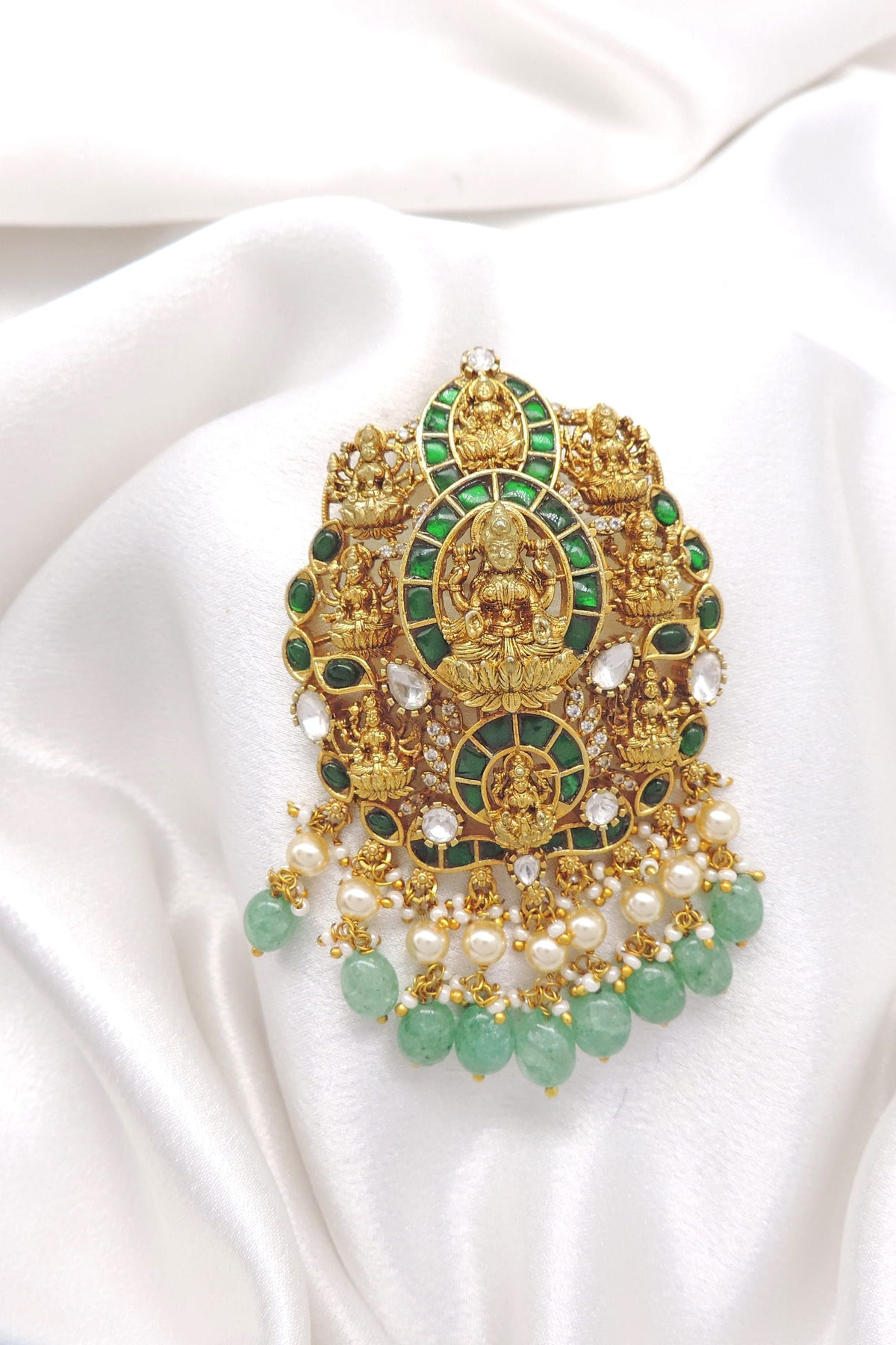 Regal green temple pendant with deity motifs, pearl drops and CZ AD accents by joyrias