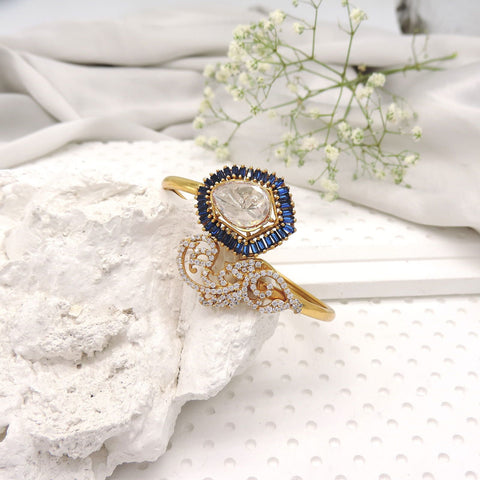 Open cuff bracelet with royal blue halo and kundan style center