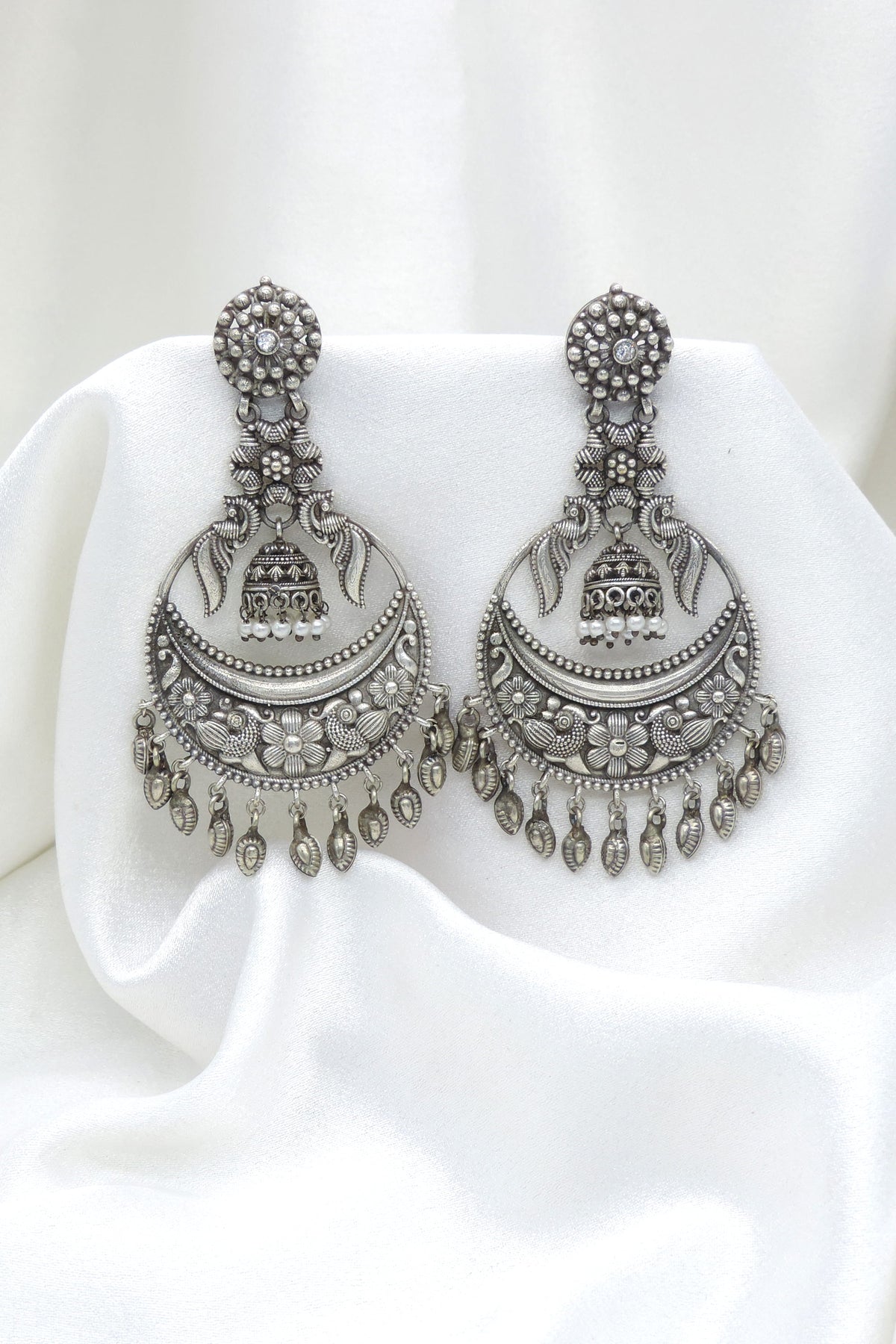 Oxidized silver floral chandbali drop earrings with traditional detailing by joyrias