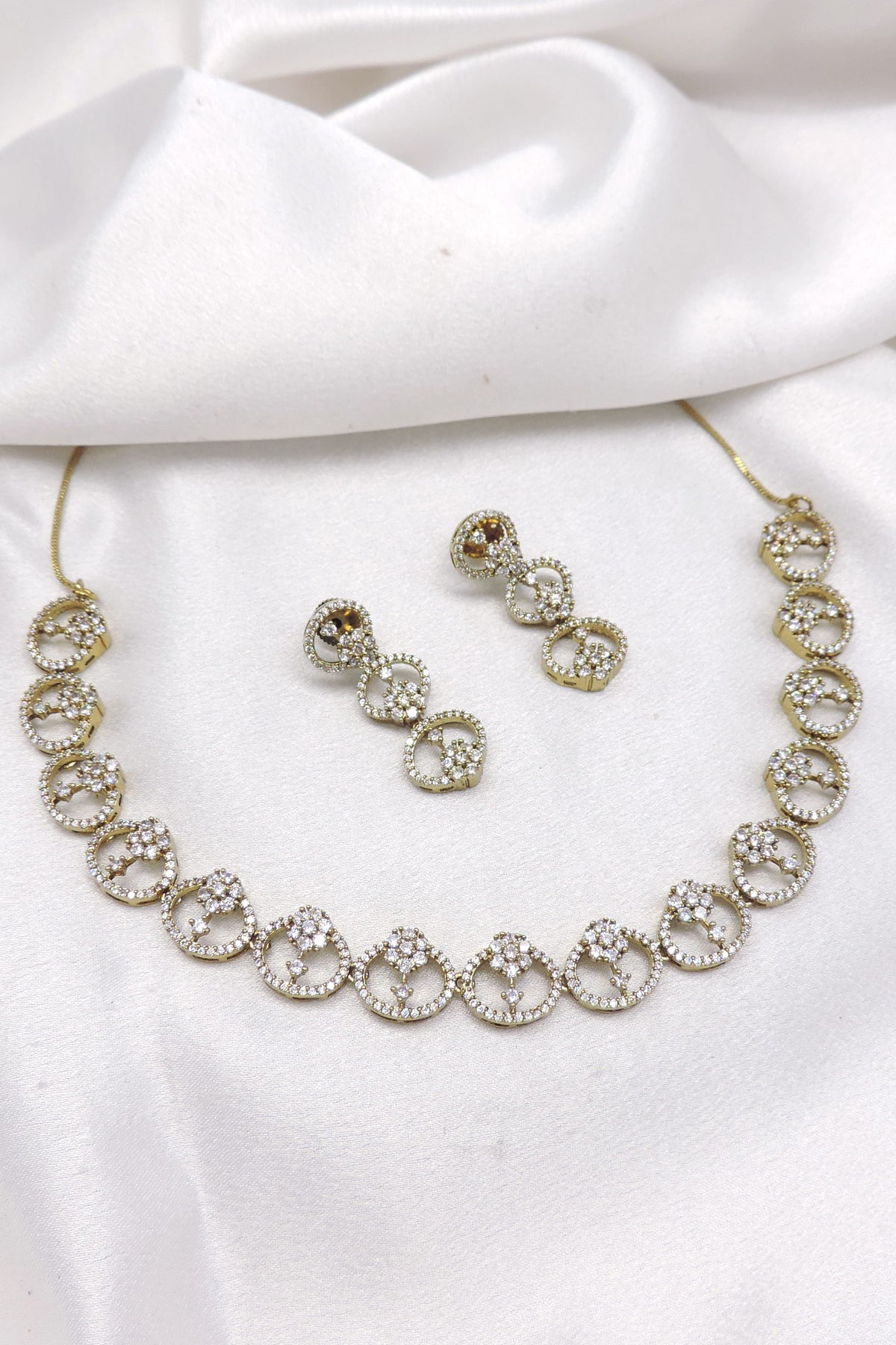 Pearl CZ AD necklace with matching earrings and gold-tone detailing by joyrias