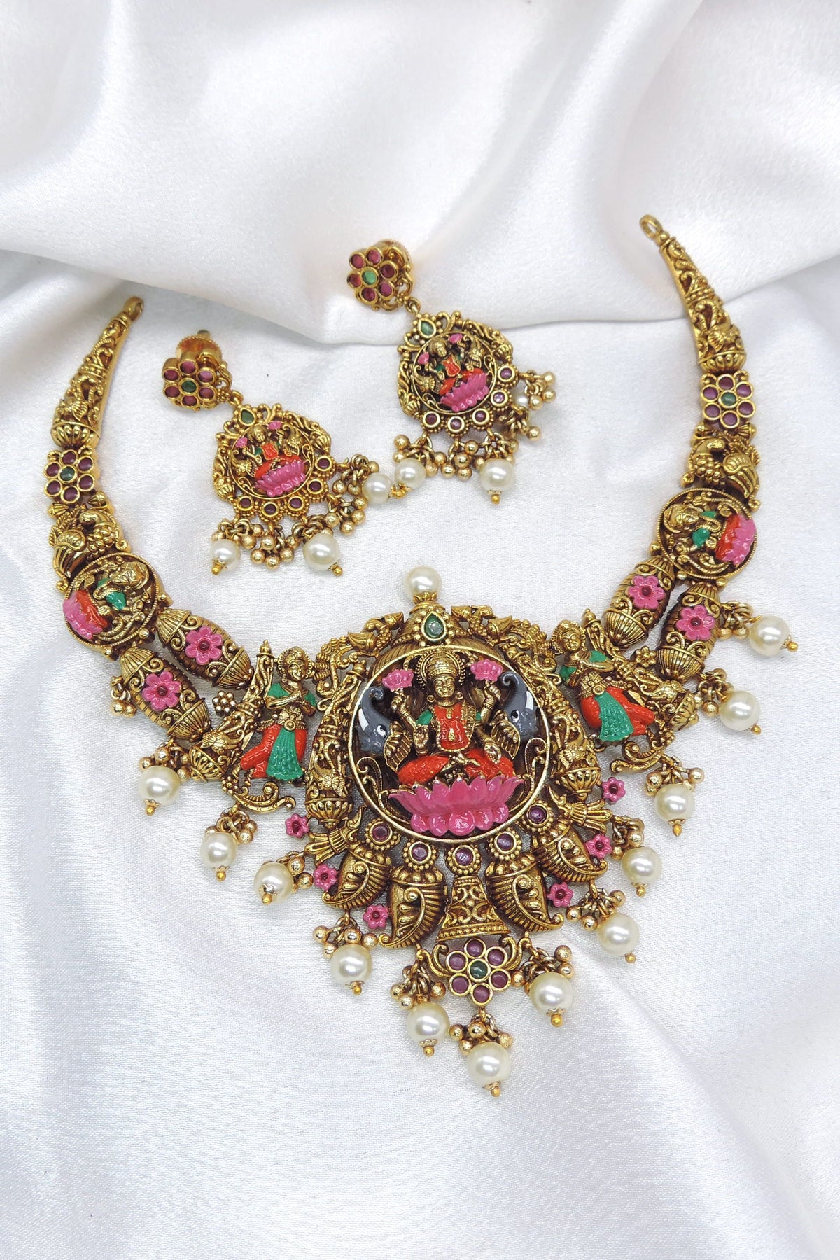 Antique gold-toned Lakshmi multicolor temple necklace set with pearl detailing and matching earrings by joyrias