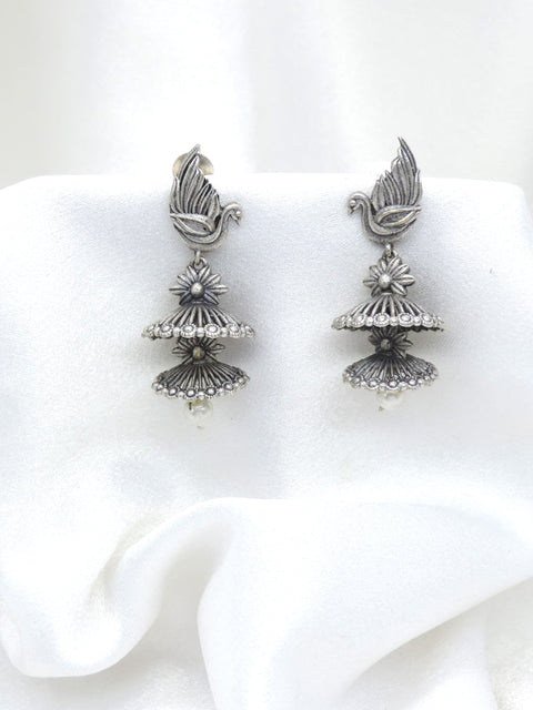 Oxidized silver bird motif double jhumka earrings with floral detailing and pearl drop by joyrias