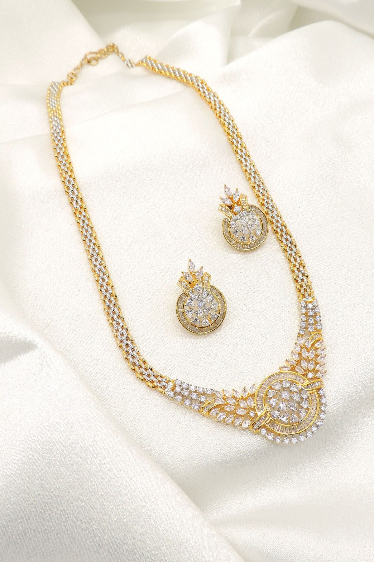 Luxury CZ statement necklace set with matching earrings and floral detailing