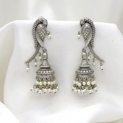 Oxidized silver peacock long jhumka earrings with pearl detailing by joyrias
