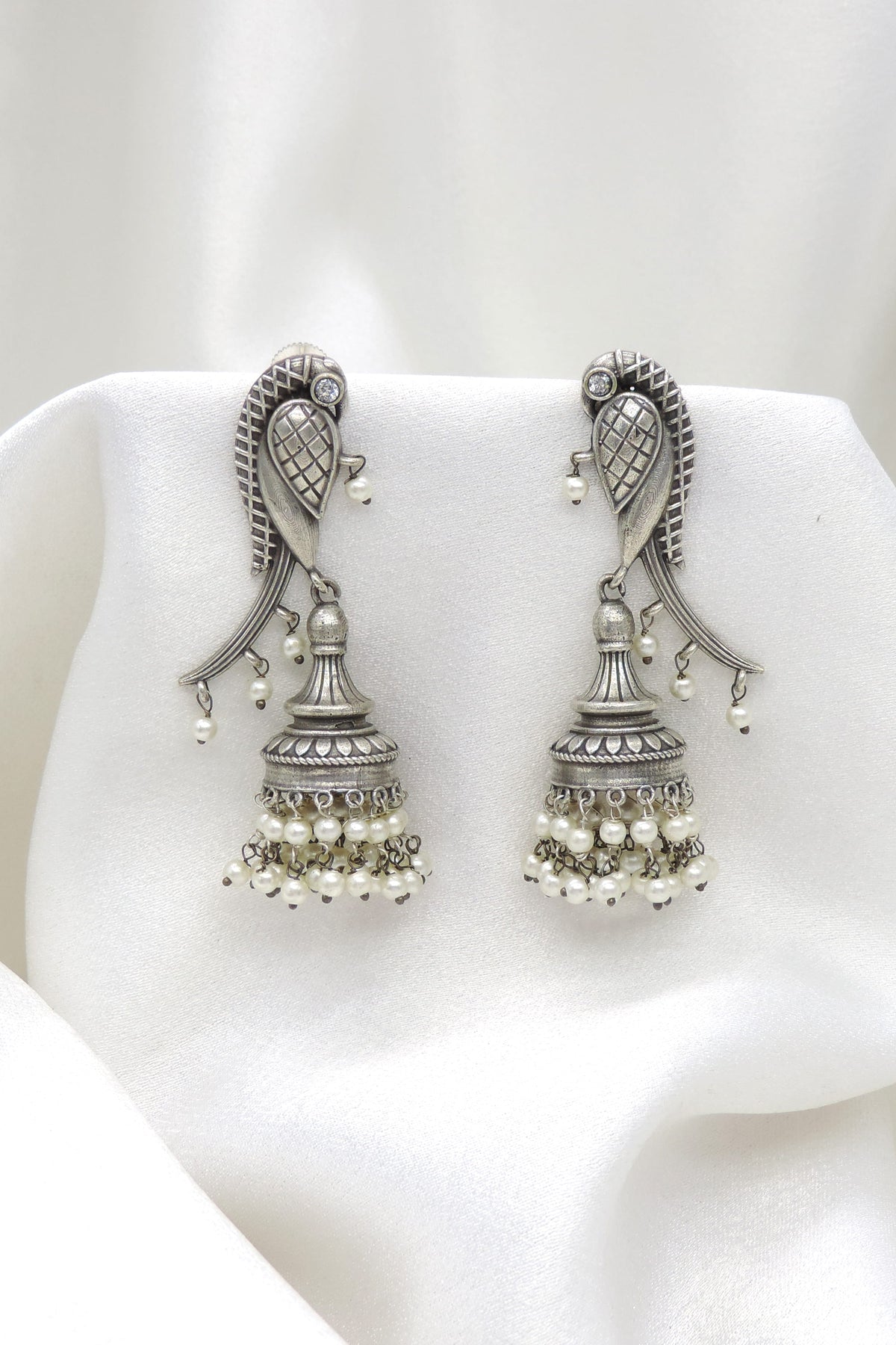 Oxidized silver peacock long jhumka earrings with pearl detailing by joyrias