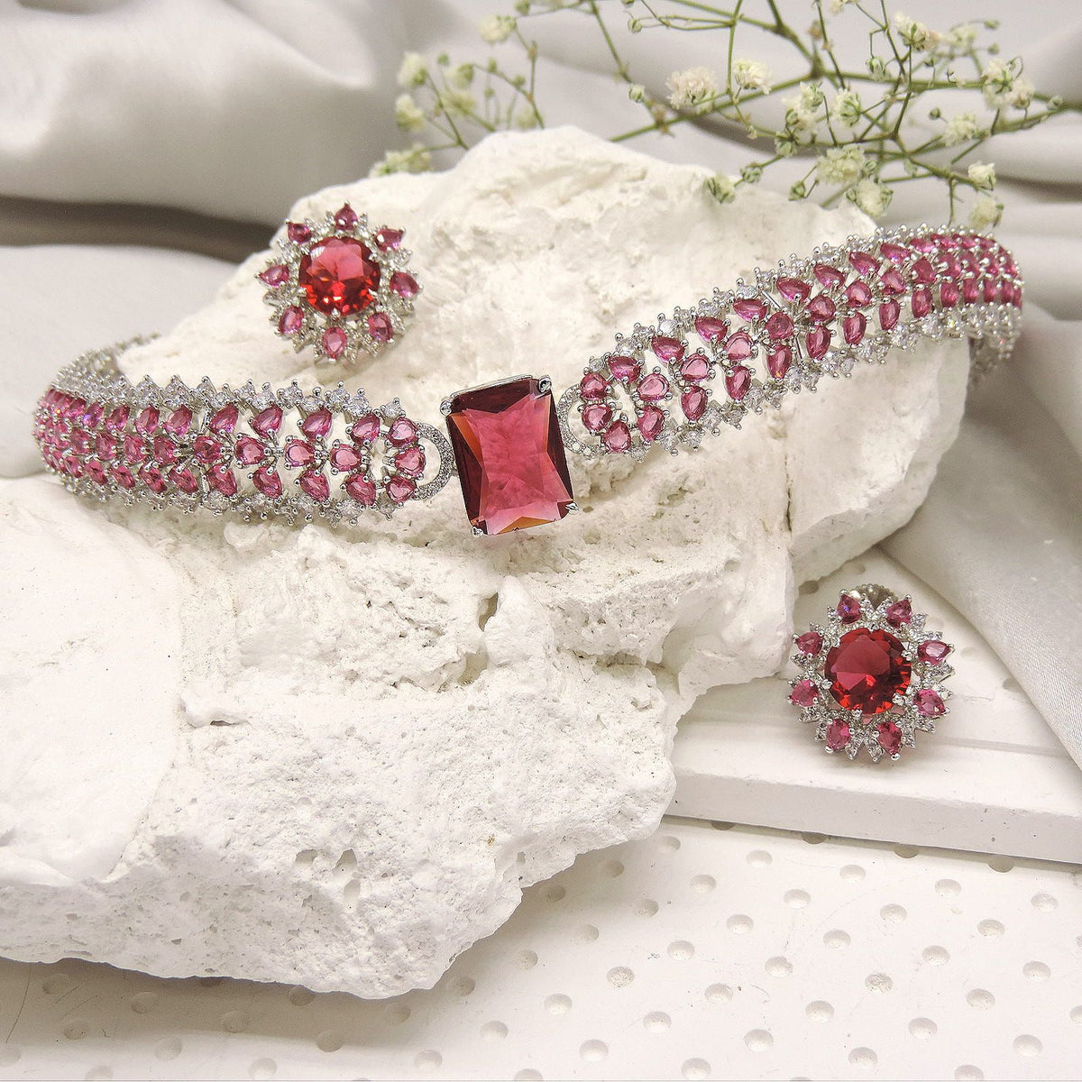 Pink crystal statement bracelet with matching floral ring