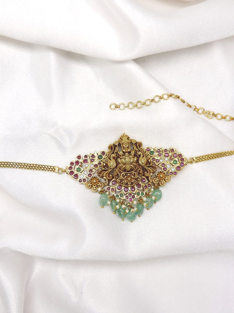 Exquisite temple gold-toned choker necklace with Lakshmi centerpiece, colorful stones and green bead drops by joyrias