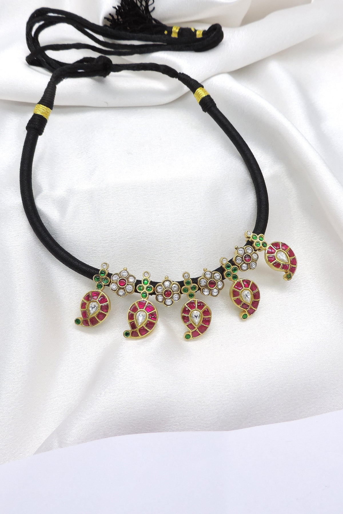 Classic kundan black thread necklace with ruby and green stones by joyrias