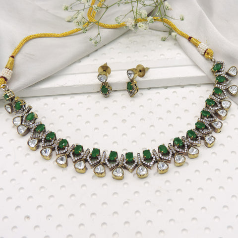 Emerald green kundan inspired necklace set with crystal drop detailing and matching earrings