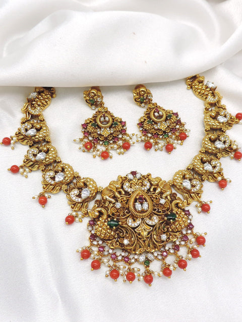 Opulent temple multicolor ruby pearl necklace set with matching earrings by joyrias