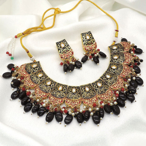 Black bead ethnic choker necklace set with intricate gold red detailing and matching earrings