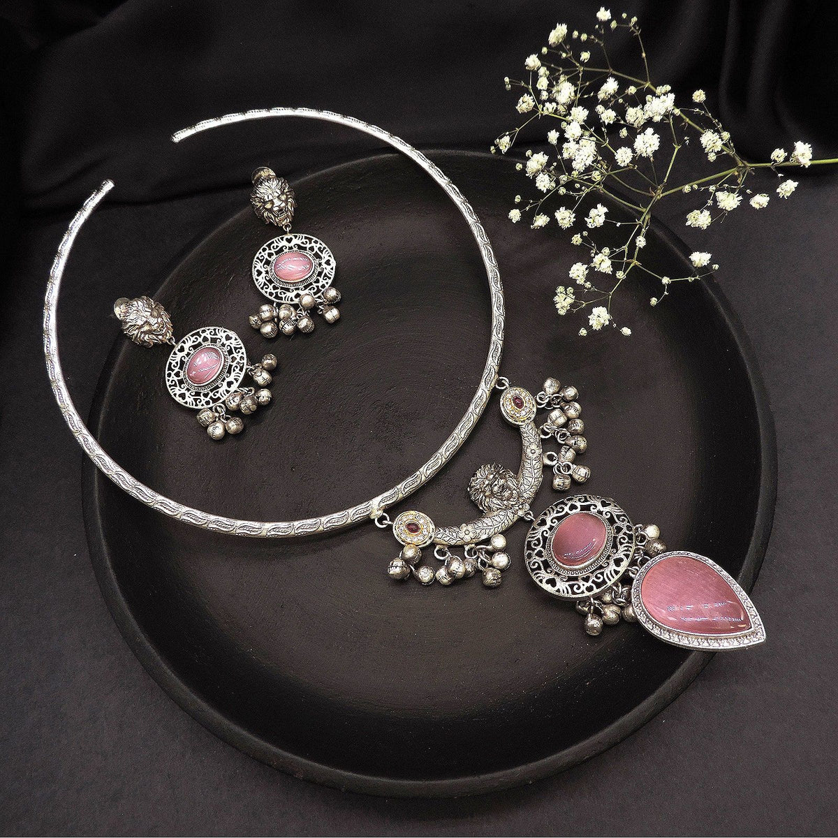 Oxidised torque necklace set with pink stones and matching earrings