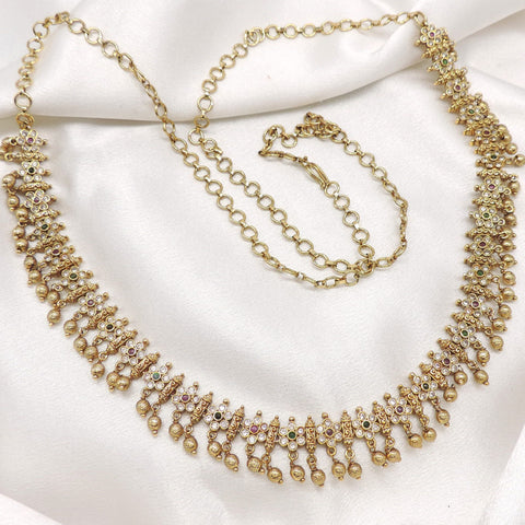 Antique kundan AD gold-toned waist chain with intricate detailing and hanging accents by joyrias