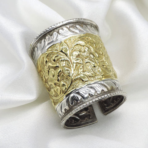 Dual-tone gold silver floral cuff bracelet with intricate engraved detailing by joyrias