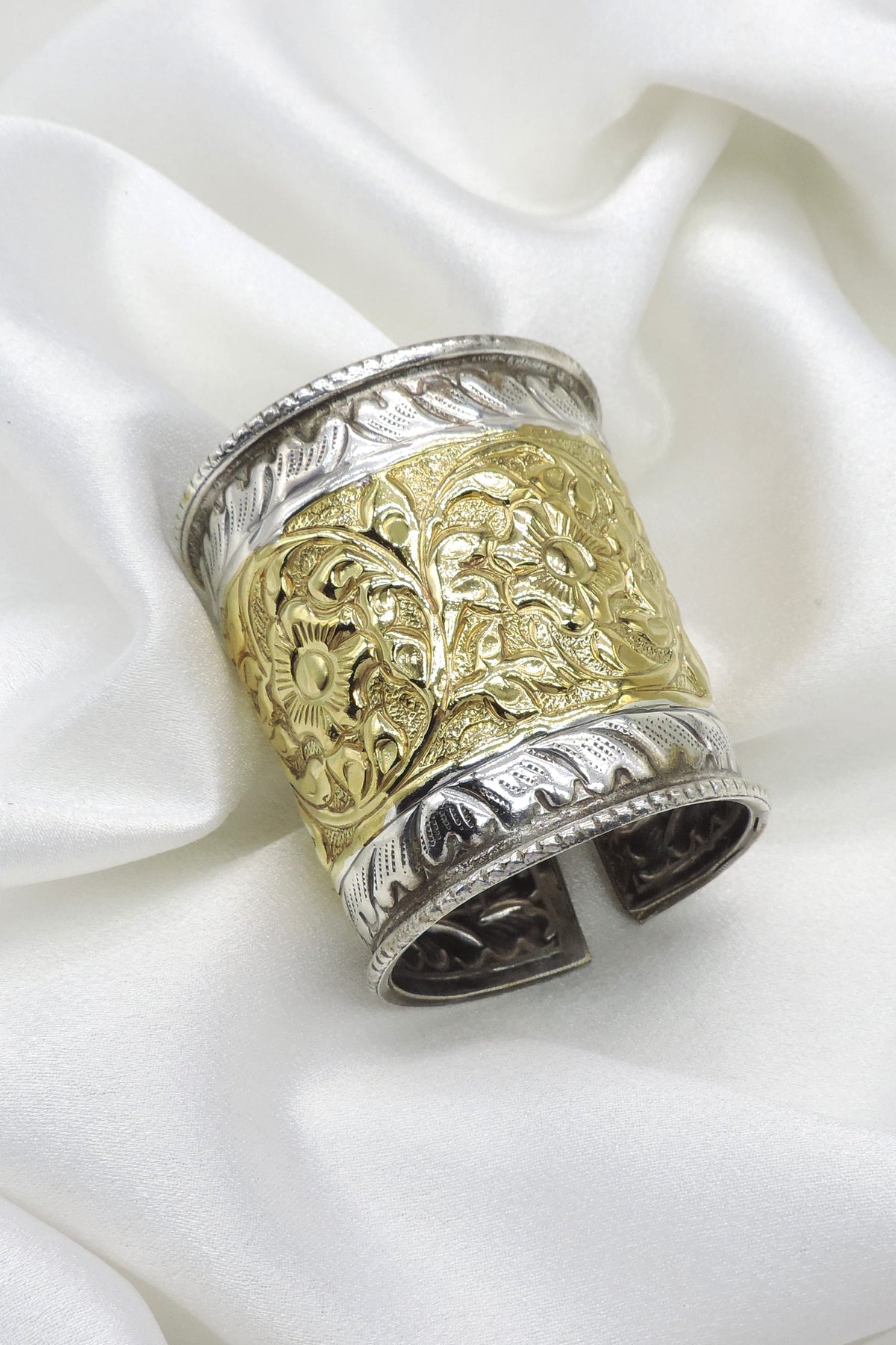 Dual-tone gold silver floral cuff bracelet with intricate engraved detailing by joyrias