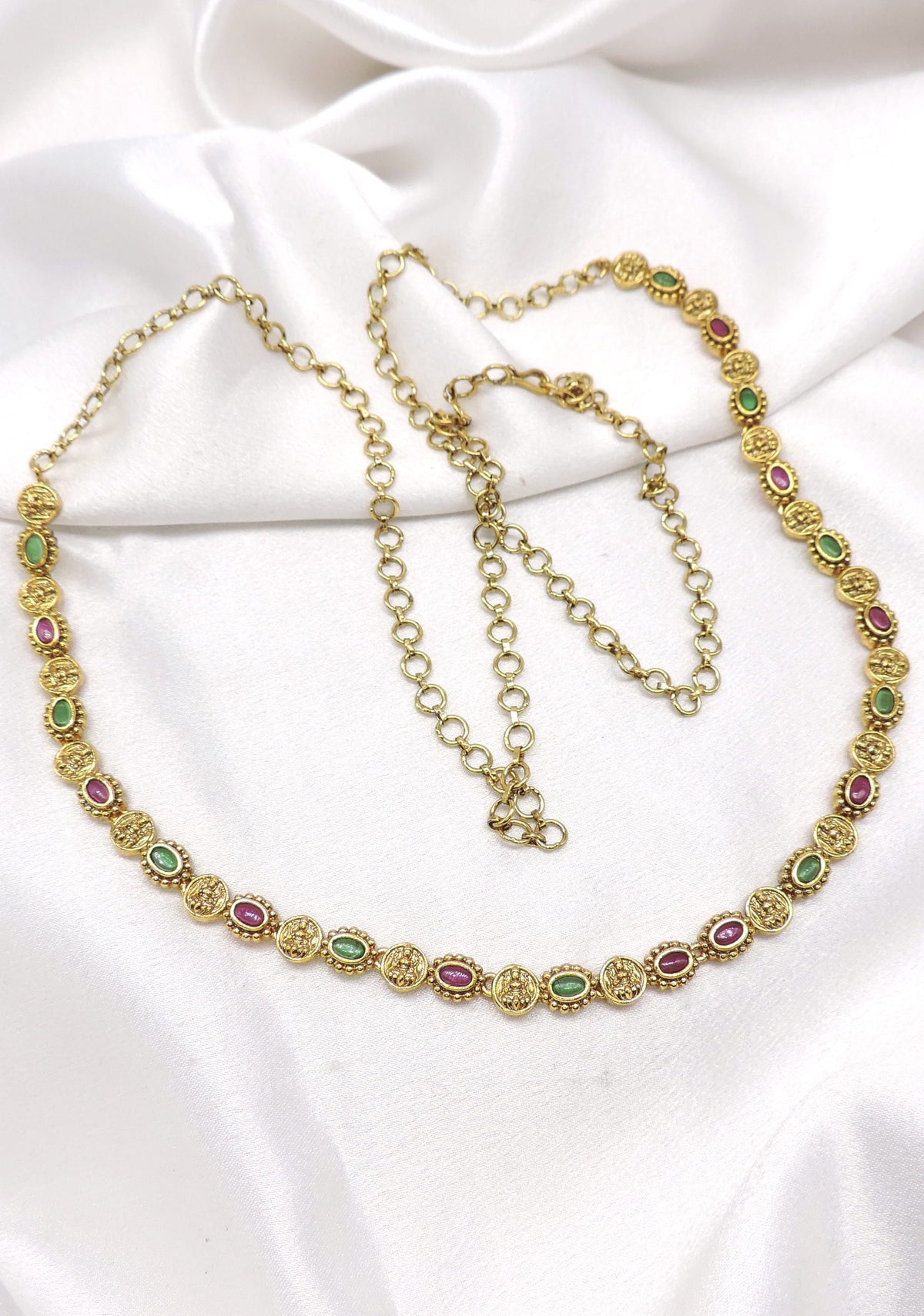 Ruby emerald temple necklace with deity motifs and gold-tone finish by joyrias