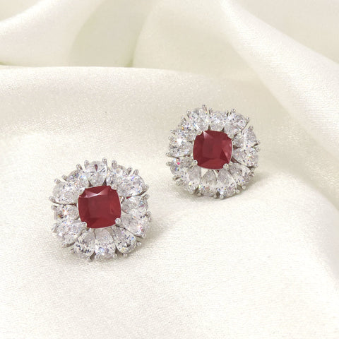 Ruby red cushion AD halo stud earrings by Joyrias