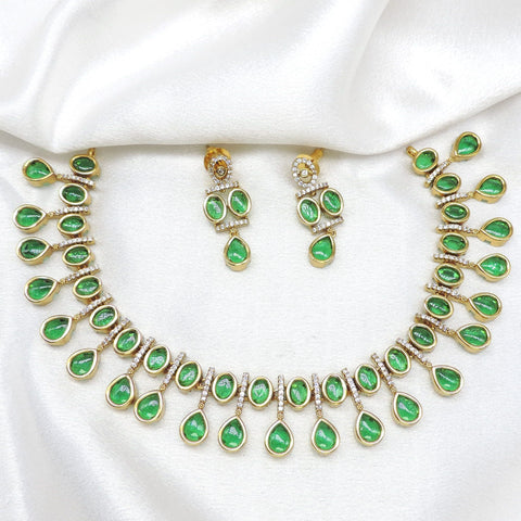 Green teardrop gold-toned AD necklace set with matching earrings by joyrias