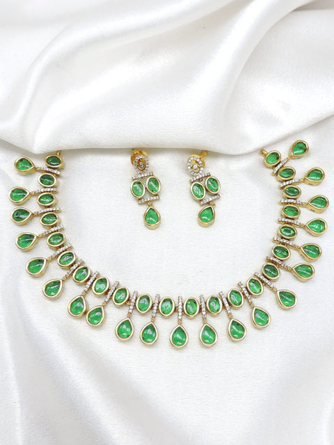Green teardrop gold-toned AD necklace set with matching earrings by joyrias