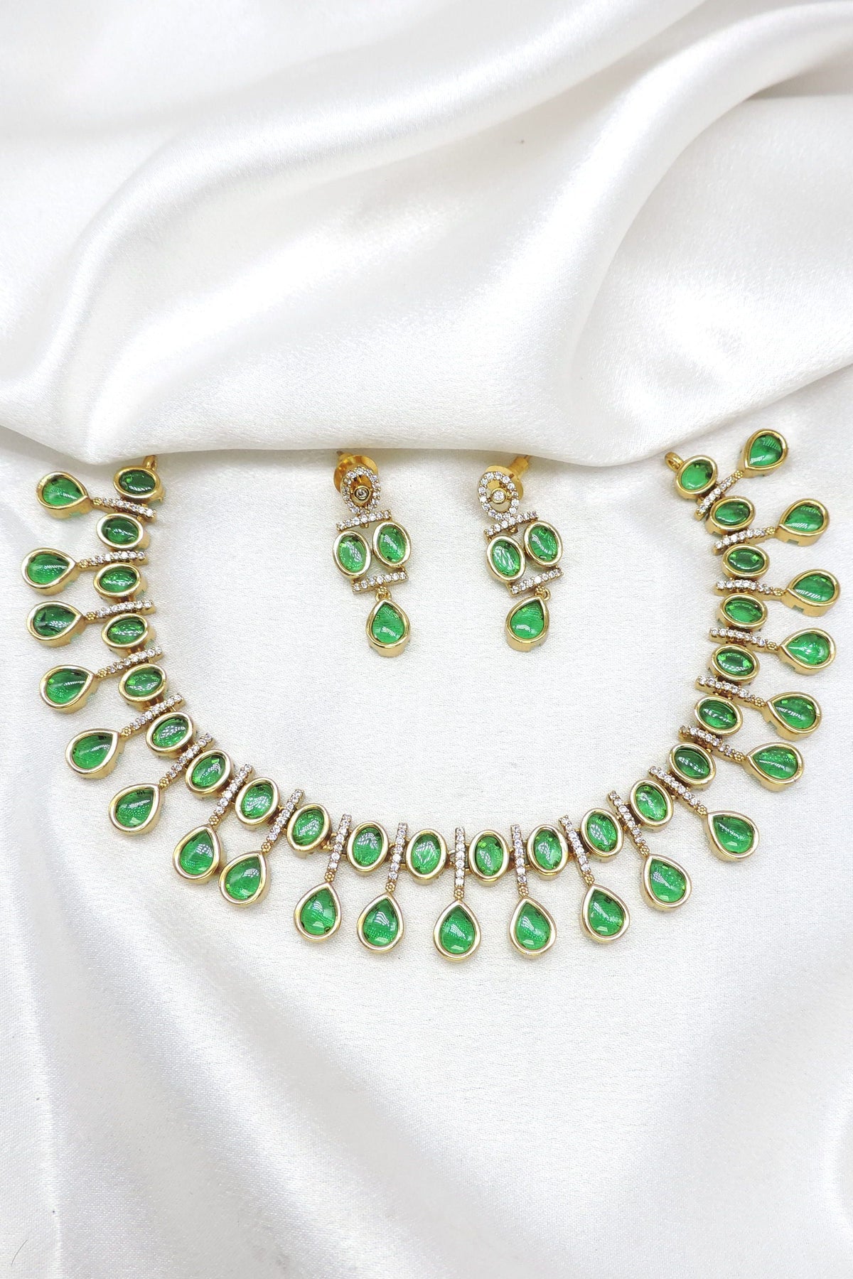 Green teardrop gold-toned AD necklace set with matching earrings by joyrias