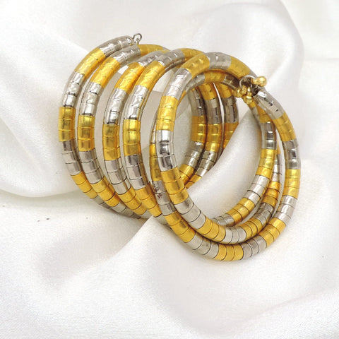 Dual-tone gold silver spiral hoop cuff bracelet with layered traditional detailing by joyrias