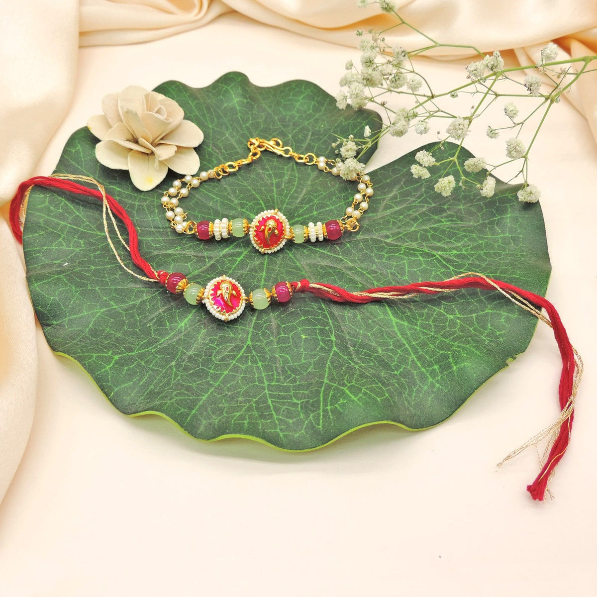 Ganesha Bhaiya Bhabhi Rakhi Set by Joyrias