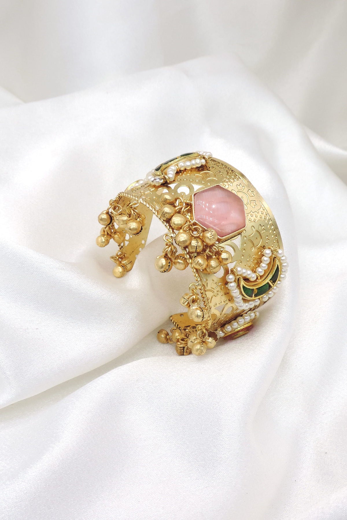 Gold-toned multicolor floral pearl cuff bracelet with green pink stones and dangling charms by joyrias