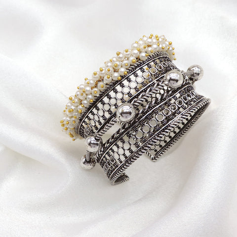 Oxidized silver layered pearl cuff bracelet with intricate textured detailing by joyrias