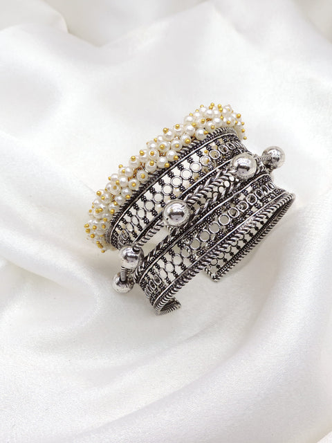 Oxidized silver layered pearl cuff bracelet with intricate textured detailing by joyrias