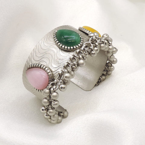 Oxidized silver multicolor stone cuff bracelet with green pink stones and delicate bead detailing by joyrias