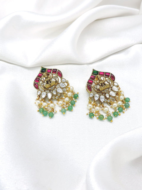 Exquisite temple ruby green pearl jhumka earrings by joyrias