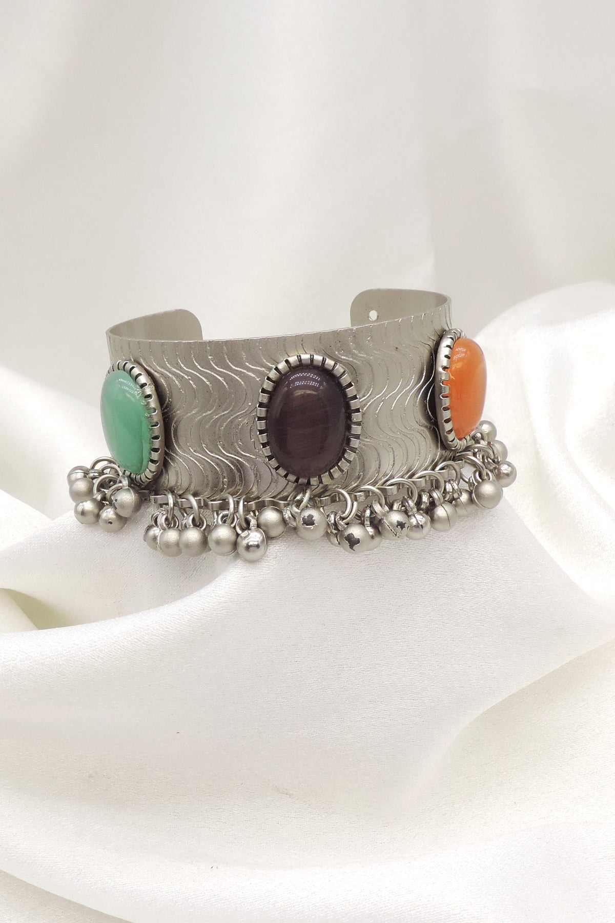 Oxidized silver multicolor stone cuff bracelet with green purple orange stones and dangling silver charms by joyrias