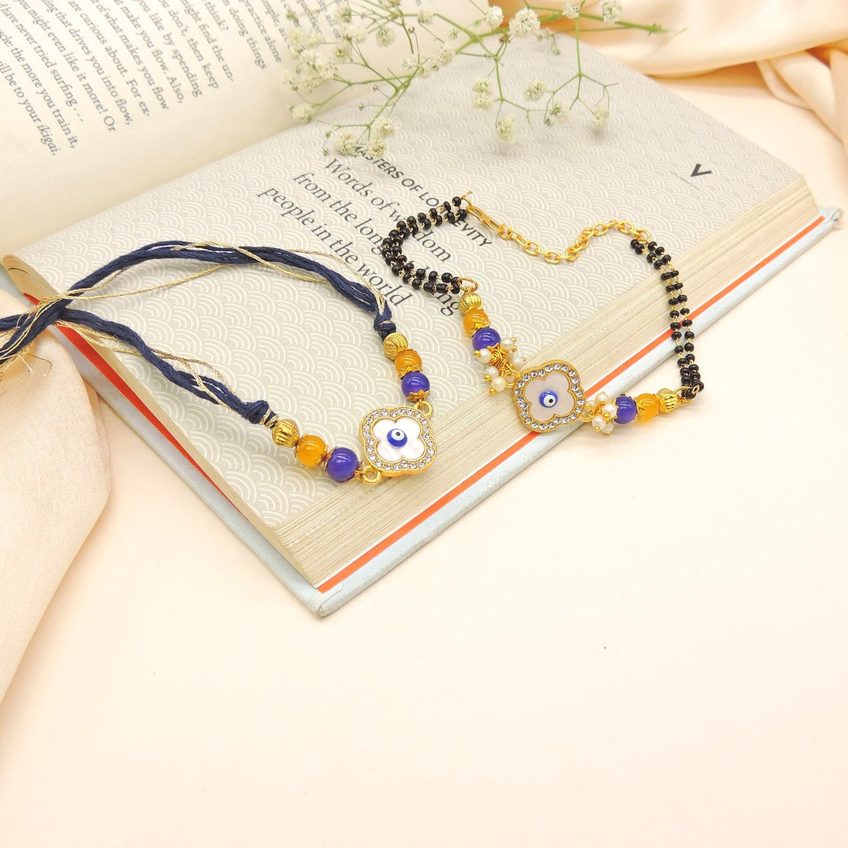 Evil Eye Floral Bhaiya Bhabhi Rakhi Set by Joyrias