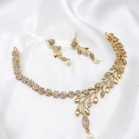 Gold-toned leaf CZ pearl necklace set with matching drop earrings by joyrias
