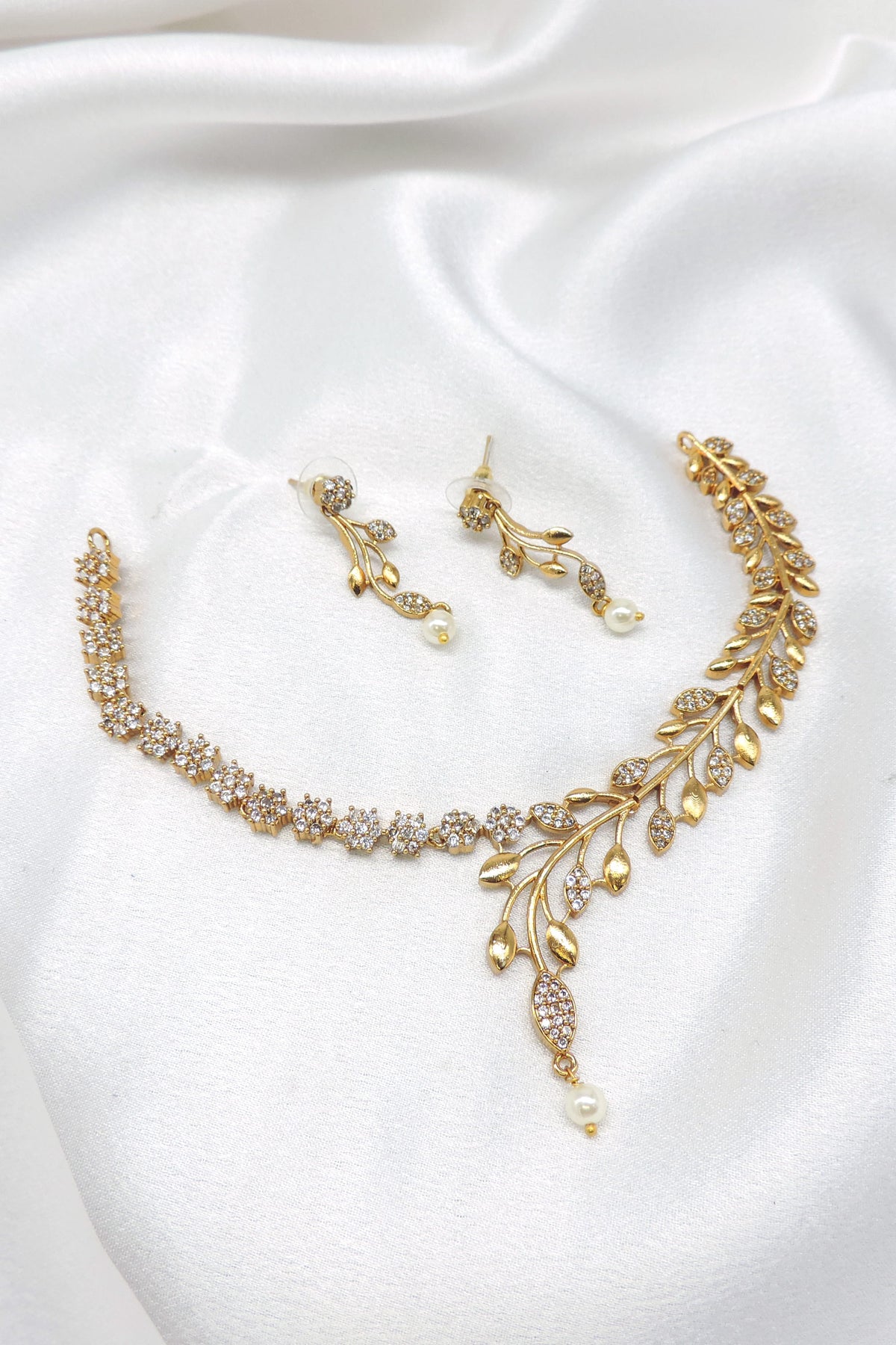 Gold-toned leaf CZ pearl necklace set with matching drop earrings by joyrias